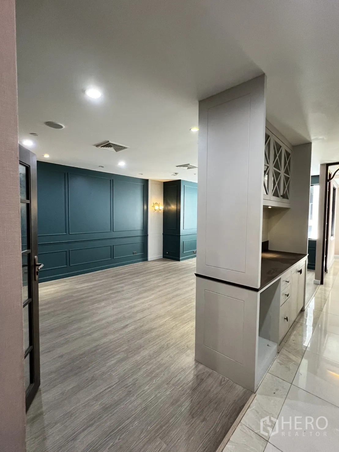 Office Space for rent in Watthana, Bangkok - Room with teal wall panels and a built-in cabinet beside the entry.