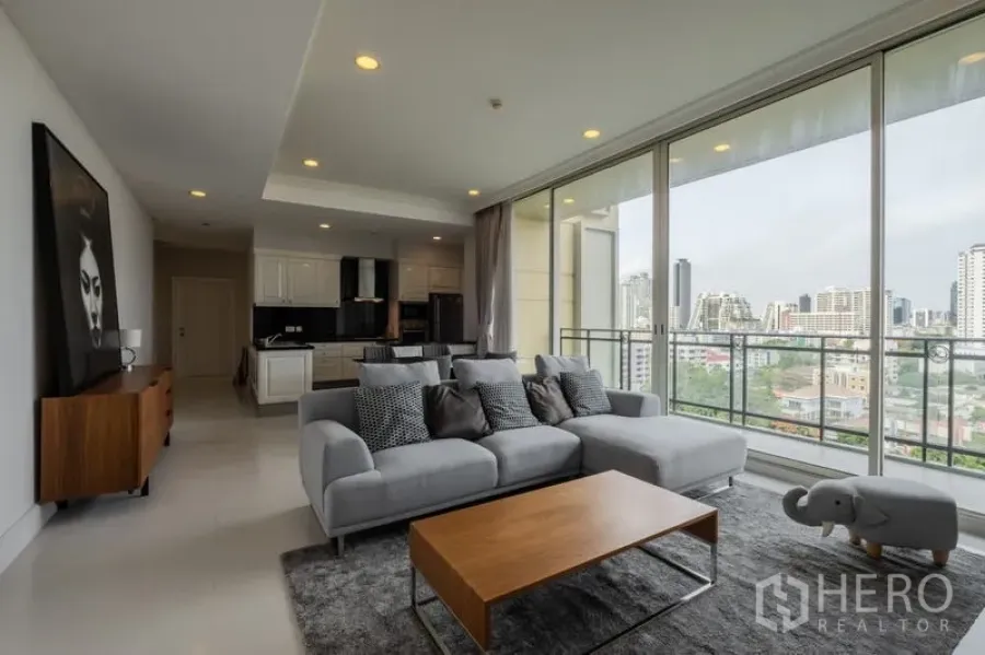 Condominium for sale - Sofa lounge facing balcony and sweeping Bangkok skyline.