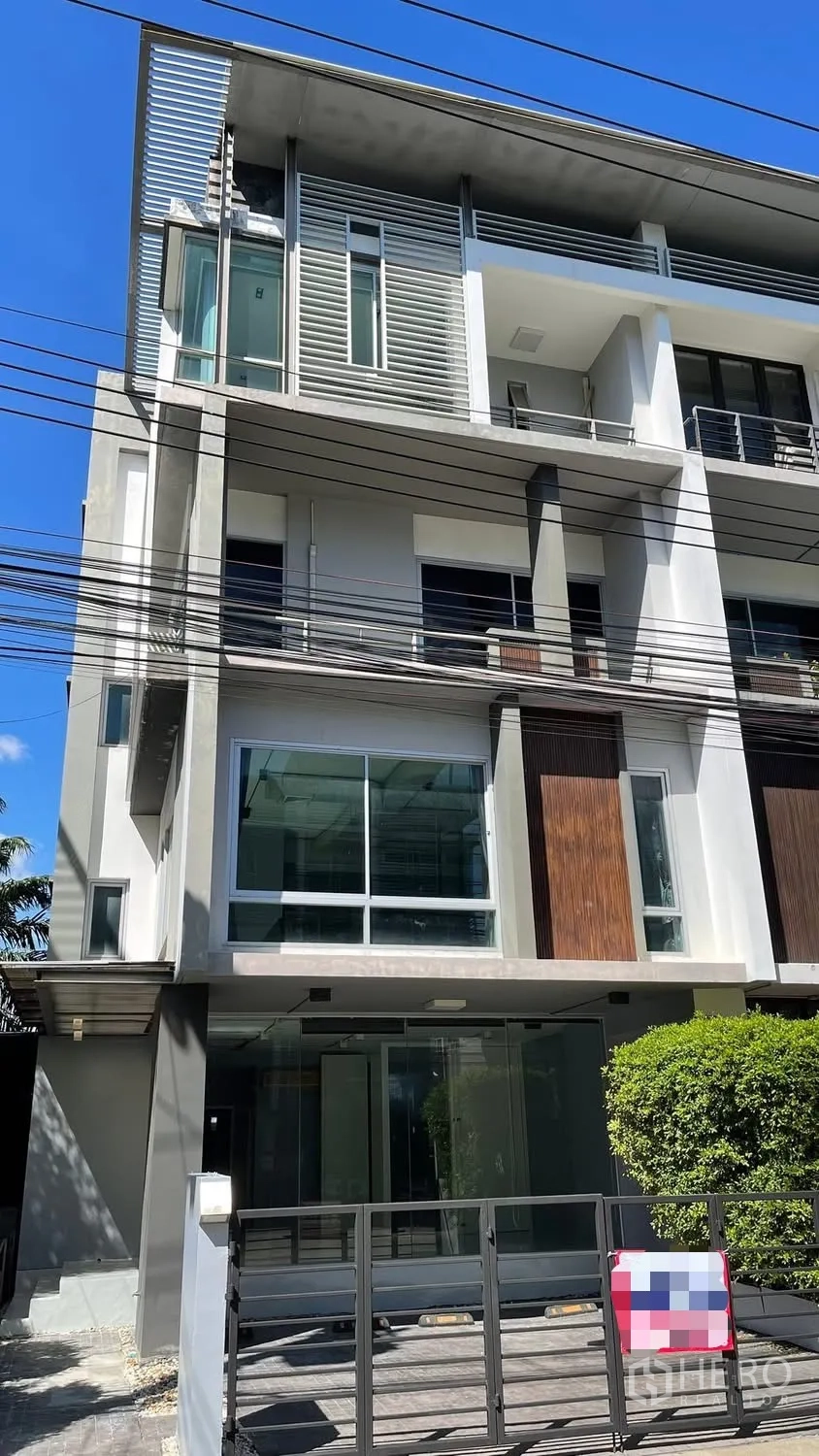 Home Office for rent or sale in Wang Thonglang, Bangkok - Modern multi-storey building facade with balconies and large windows.