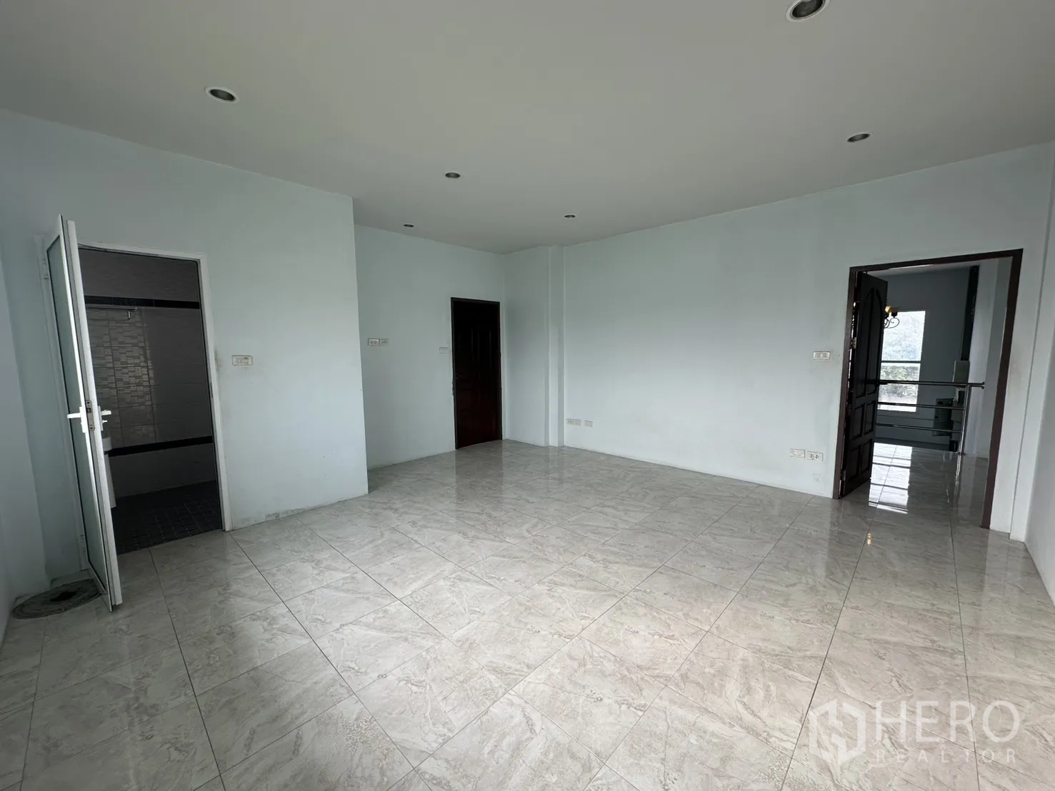 Home Office for rent - Bedroom corner with frosted glass door and tiled flooring.