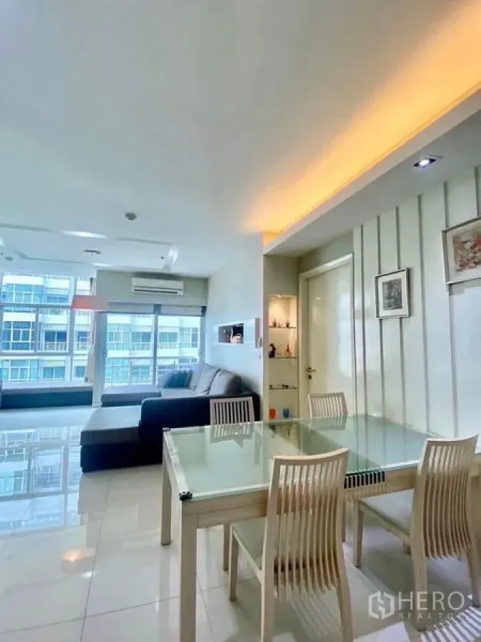 Condominium for rent or sale in Bang Kapi, Bangkok - Open living and dining area with floor-to-ceiling windows and urban views.
