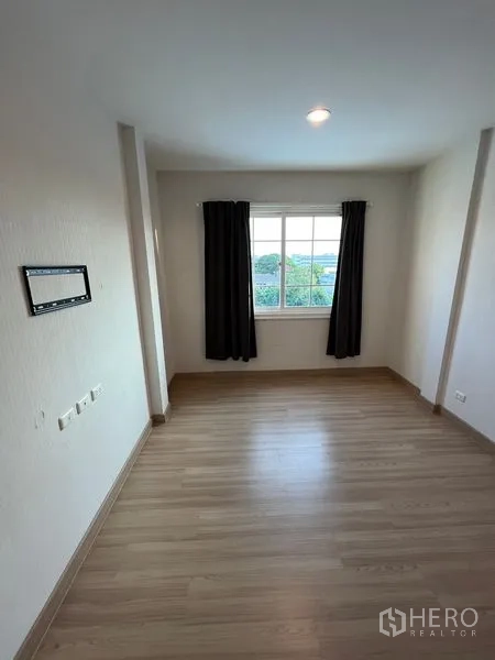 Home Office for rent or sale - Cozy bedroom with window, blackout curtains and wood flooring.