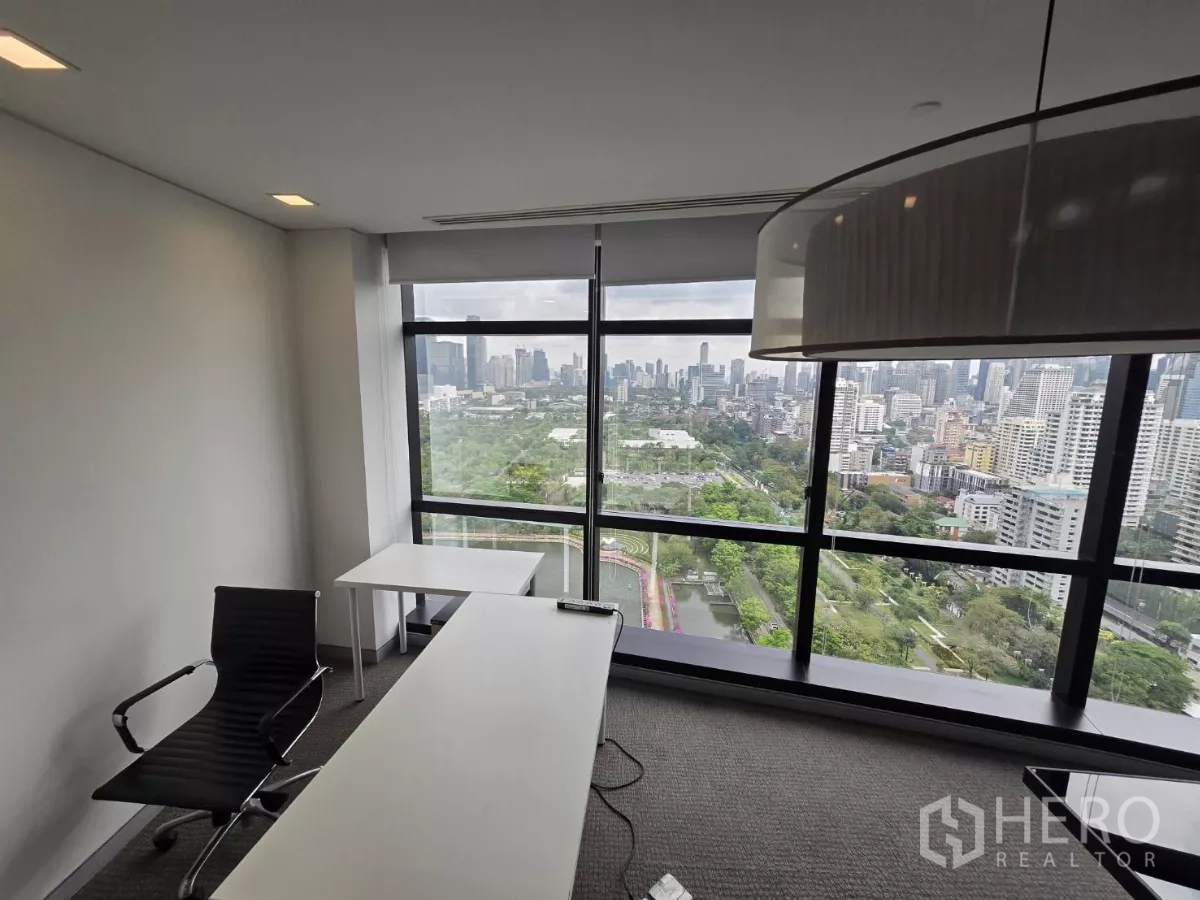 Office Space for rent in Watthana, Bangkok - Executive office with desk facing expansive city and park views.