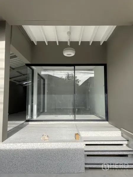 Home Office for rent in Khlong Toei, Bangkok - Raised entry terrace with steps leading to full-height sliding glass doors