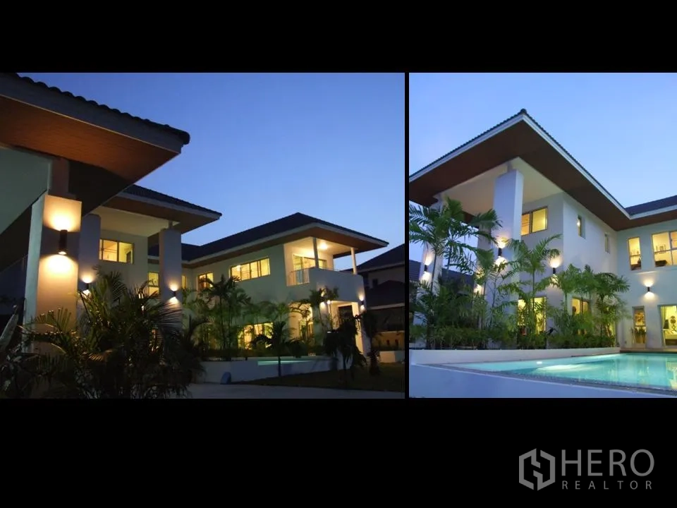 Detached House for rent in Khan Na Yao, Bangkok - Contemporary Bangkok villa exterior at twilight showing wide eaves, warm window lights and poolside greenery.