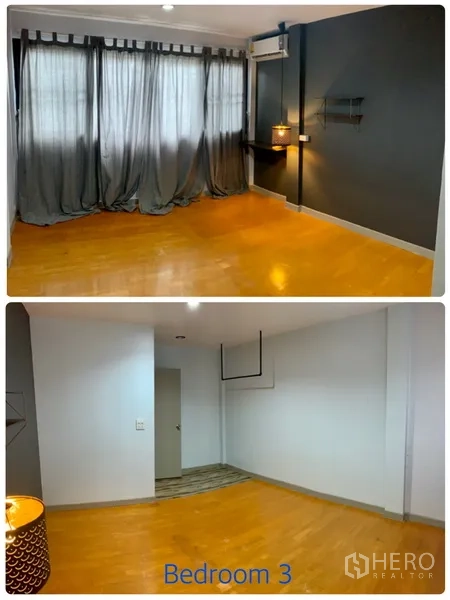 Townhouse for rent in Watthana, Bangkok - Third bedroom with grey accent wall, sheer curtains and wood flooring.