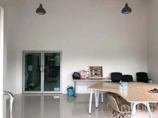 Factory for rent or sale in Wang Noi, Phra Nakhon Si Ayutthaya - Bright office and meeting area with glass partition doors and pendant lights.