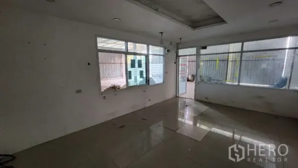 Warehouse for rent in Bang Khen, Bangkok - Internal office room with windows looking out to the warehouse floor.