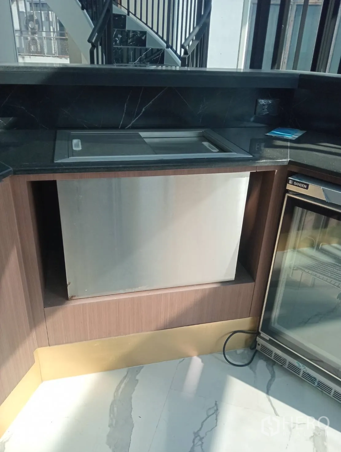 Retail Space for rent - Double glass-door beverage fridge under counter.