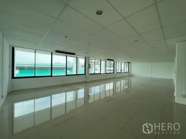 Office Space for rent - Bright corner office area with full-height windows, polished tiles and ceiling cassette air-conditioning, ready for fit-out.