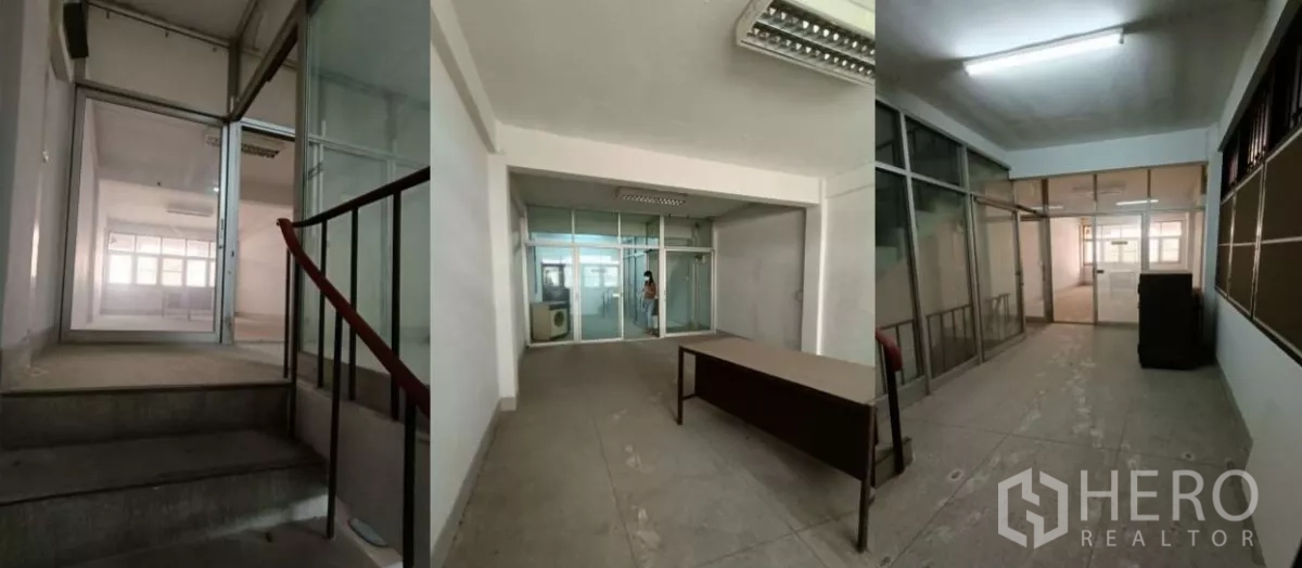 Shophouse for rent in Bang Rak, Bangkok - Upper-floor office area with glass partitions and lighting beside the stairwell.