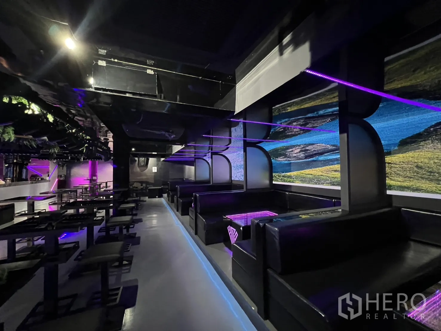 Retail Space for rent in Watthana, Bangkok - Upholstered booth seating with purple strip lights and digital wall displays.