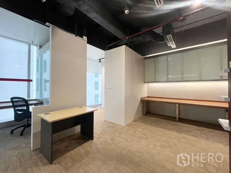 Office Space for rent in Watthana, Bangkok - Partitioned workspace with desk, glass dividers, overhead cabinets and a long counter.