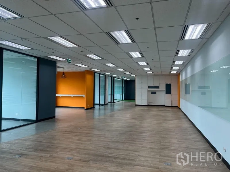 Office Space for rent in Chatuchak, Bangkok - Spacious office floor with glass rooms, whiteboard wall, orange accents and open-plan layout.