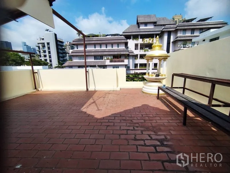 Detached House for rent in Watthana, Bangkok - Rooftop terrace with red tiles, bench seating, and neighborhood city views.