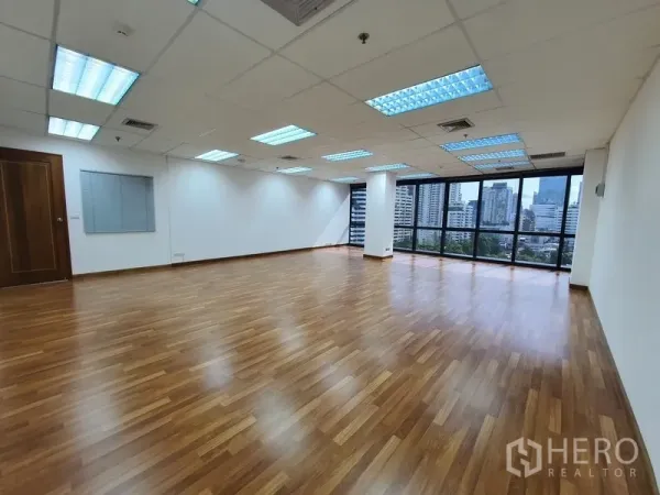 Office Space for rent in Watthana, Bangkok - Spacious 70 sqm office with wood flooring, suspended ceiling lights and city outlook.