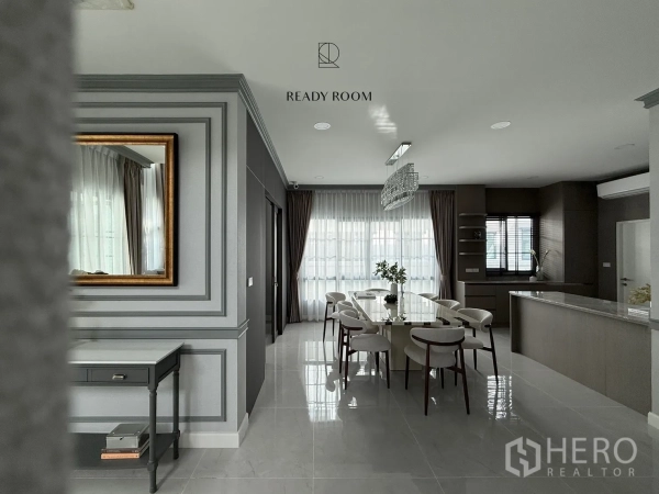Detached House for rent or sale in Bang Phli, Samut Prakan - Open-plan dining and kitchen with glossy tile flooring, wall mouldings and floor‑to‑ceiling curtains.