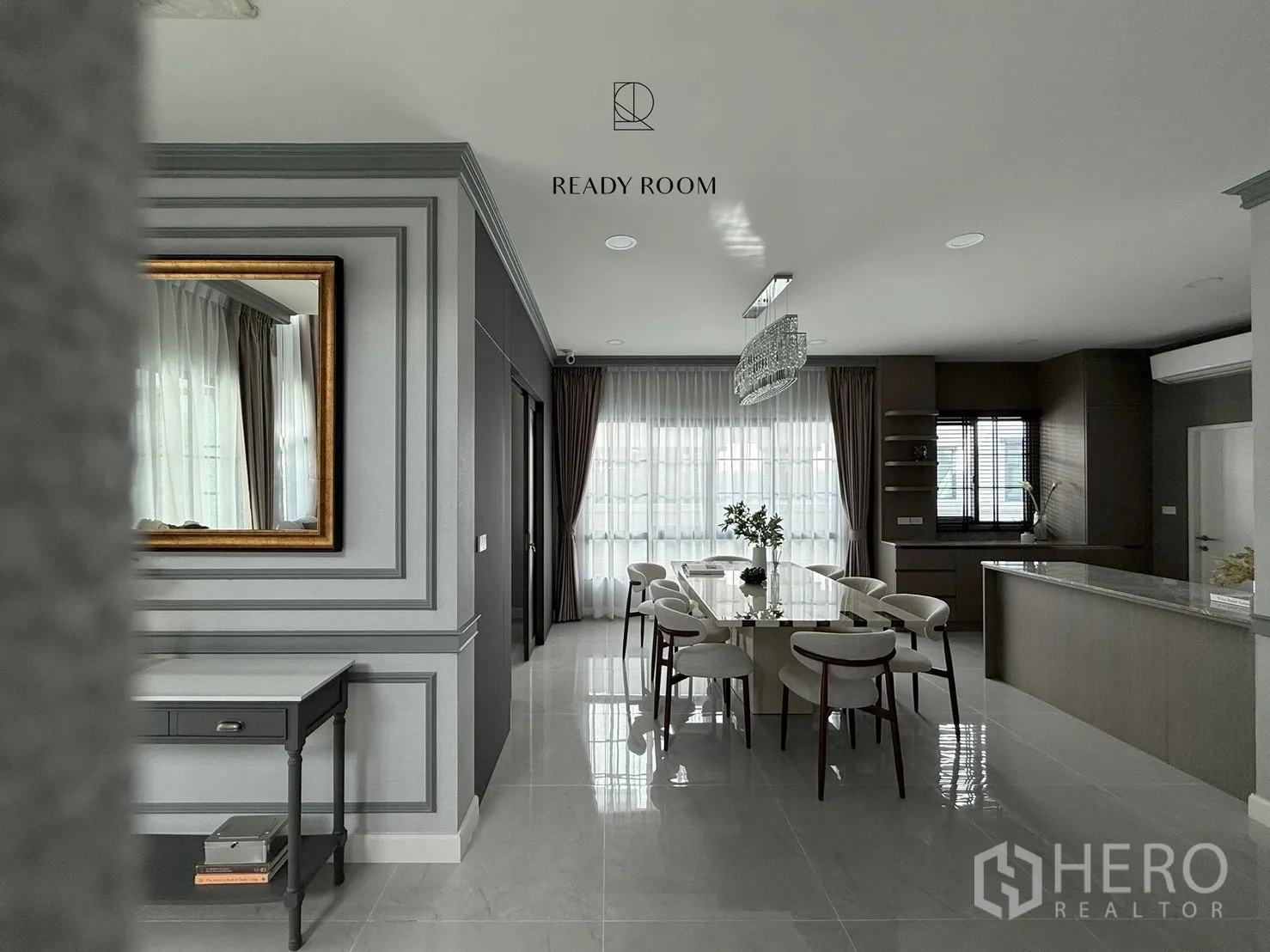 Detached House for rent or sale in Bang Phli, Samut Prakan - Open-plan dining and kitchen with glossy tile flooring, wall mouldings and floor‑to‑ceiling curtains.
