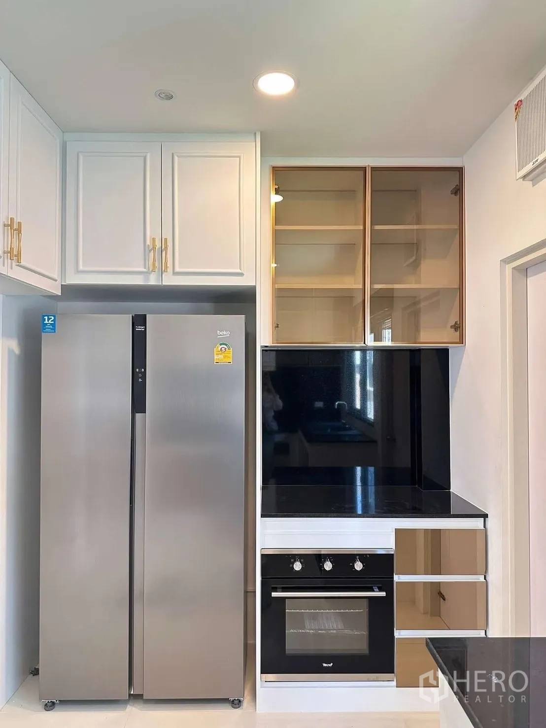 Detached House for rent in Bang Phli, Samut Prakan - Appliance wall featuring side-by-side refrigerator and built-in oven.