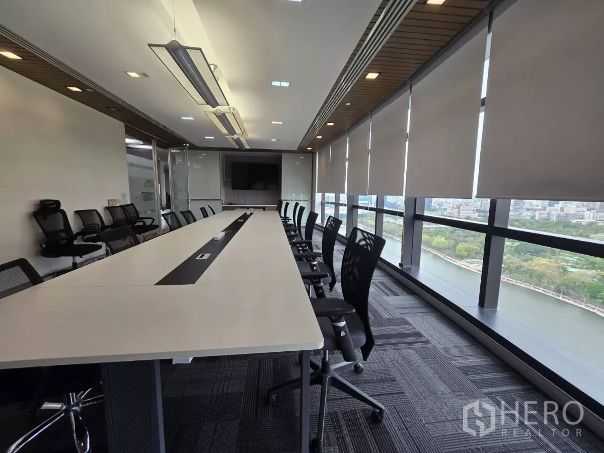Office Space for rent in Watthana, Bangkok - Long boardroom with conference table, ergonomic chairs and river-park views.