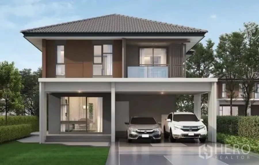 Detached House for rent or sale in Lam Luk Ka, Pathum Thani - Front elevation of a contemporary two-storey detached home with balcony and two-car driveway.