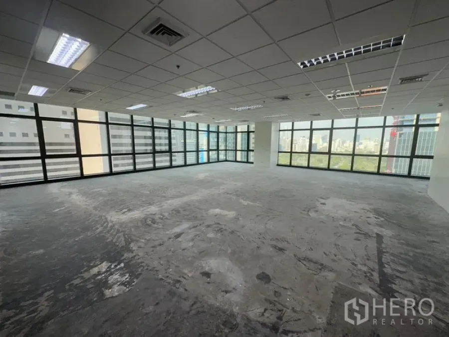 Office Space for rent in Bang Rak, Bangkok - Bright shell office space with suspended ceiling, air vents, and wall-to-wall glazing ready for fit-out.