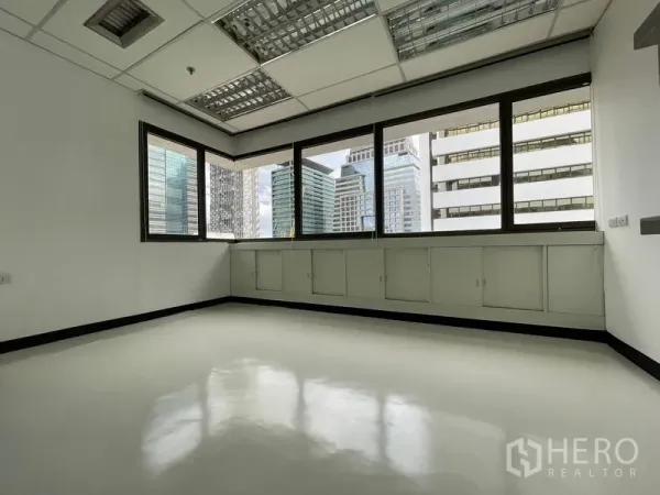 Office Space for rent in Bang Rak, Bangkok - Corner meeting room with wraparound windows and city views.