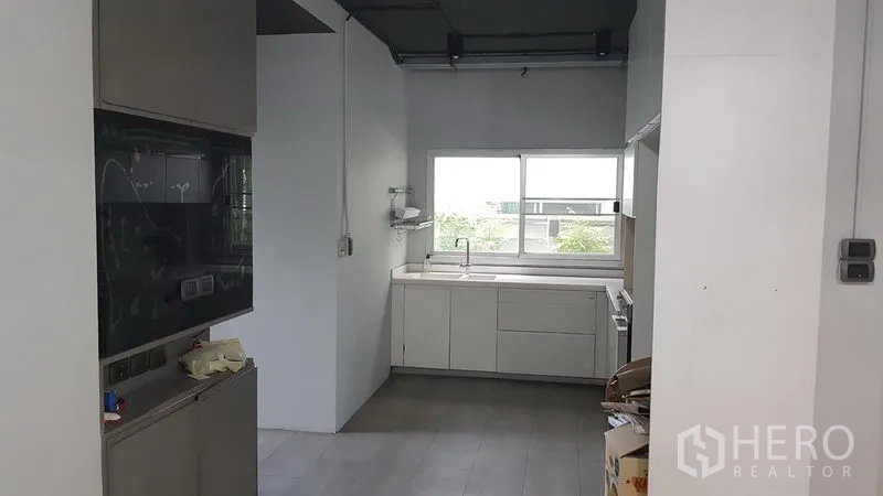 Home Office for sale in Wang Thonglang, Bangkok - Secondary pantry kitchen with white cabinetry and window light