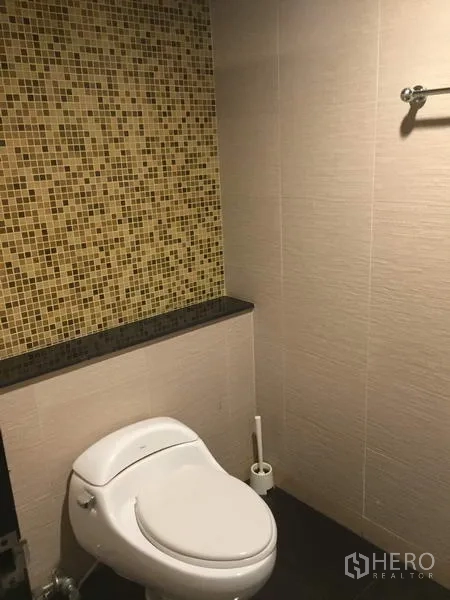 Retail Space for rent in Khlong Toei, Bangkok - Toilet room with mosaic tile accent wall, counter ledge and towel rail.