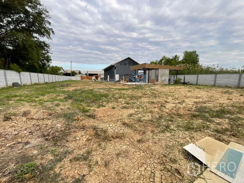 Warehouse for rent or sale in Nong Chok, Bangkok - Large vacant land area within perimeter wall, suitable for parking, laydown or future build.