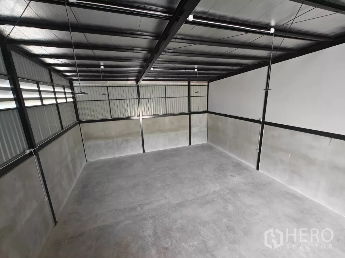 Warehouse for rent in Sam Phran, Nakhon Pathom - Top view of the warehouse hall with LED lighting and ventilation panels.