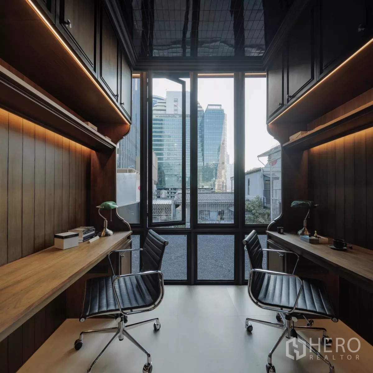 Office Space for rent in Bang Rak, Bangkok - Bright twin desks in front of a full‑height window with skyline backdrop