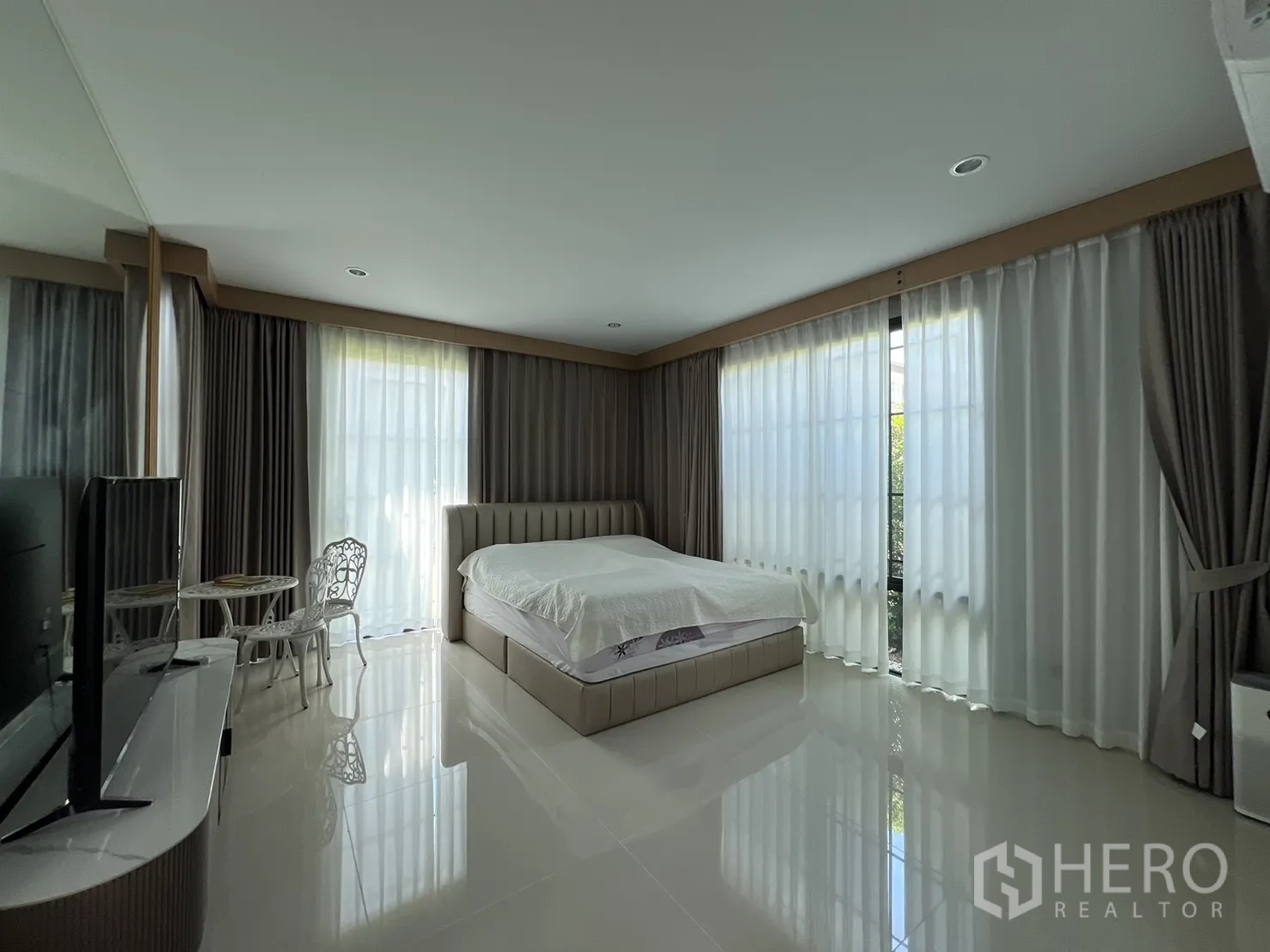 Detached House for rent or sale in Mueang Pathum Thani, Pathum Thani - Small storage or utility room with tiled floor and sliding glass door.
