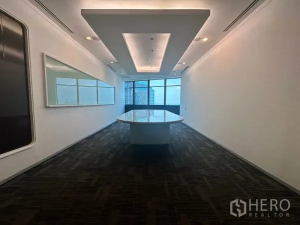 Office Space for rent in Khlong Toei, Bangkok - Boardroom with long conference table, recessed ceiling lights and city view windows.