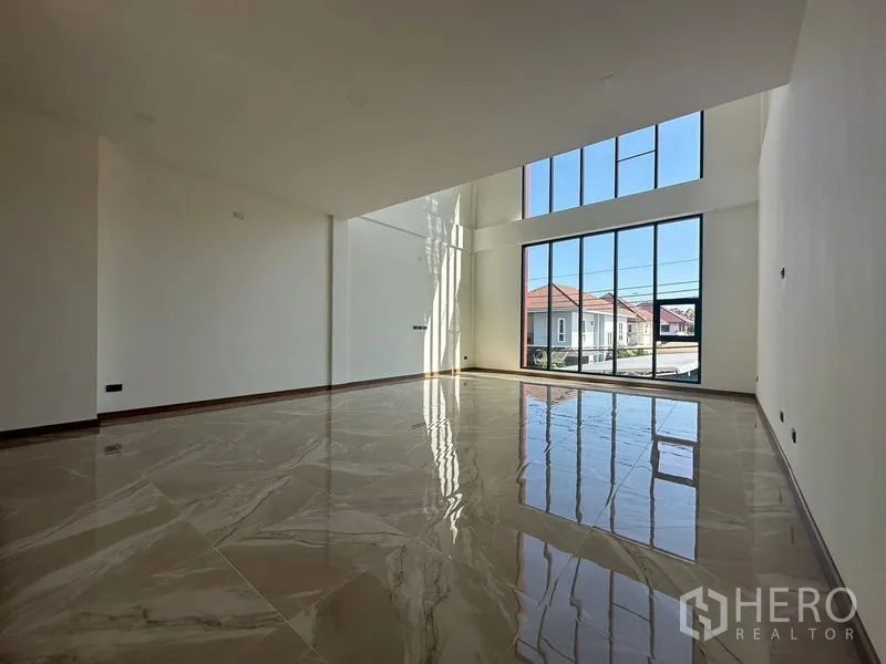 Home Office for rent in Wang Thonglang, Bangkok - Sunlit open-plan space with glossy tiles and a wall of full-height glazing.