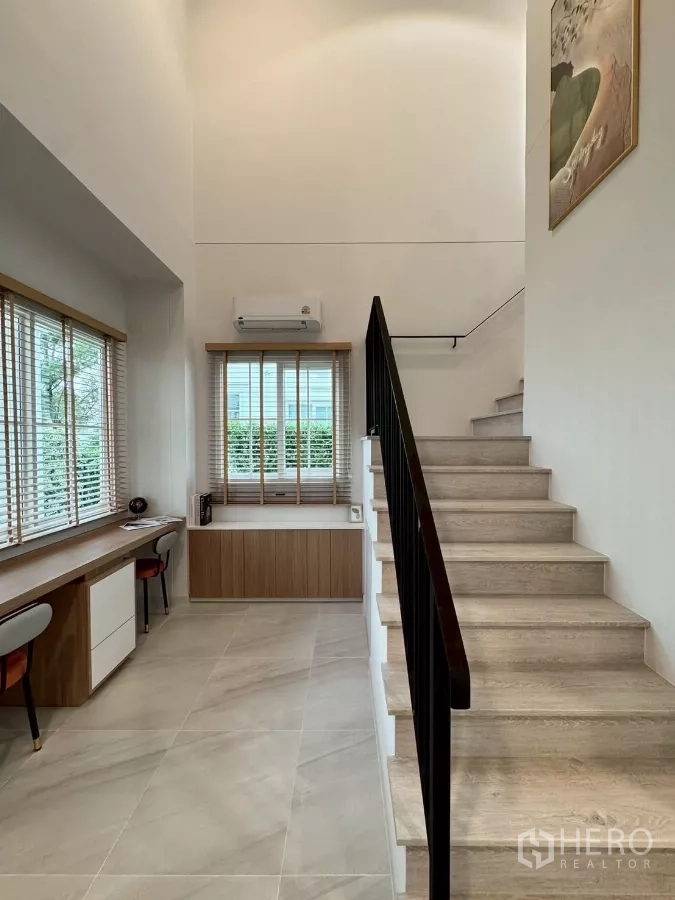 Detached House for rent in Bang Phli, Samut Prakan - Stair hall with light-wood steps and long study desk beside windows