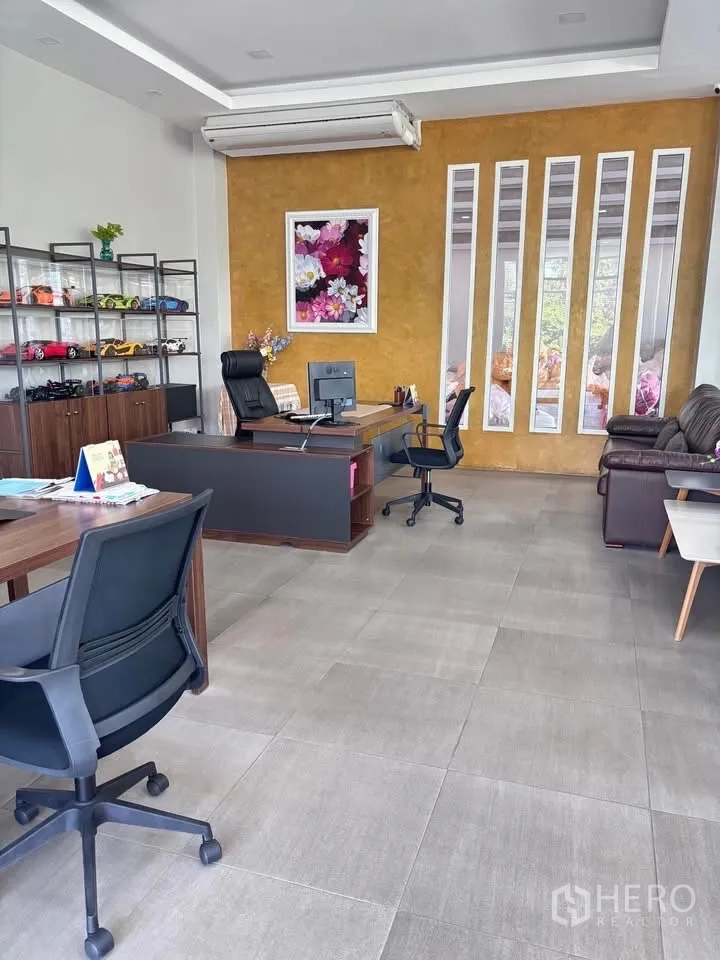 Factory for sale in Krathum Baen, Samut Sakhon - Private executive office with desks, shelving, and an accent wall.