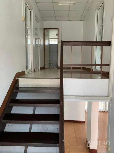 Office Space for rent in Chatuchak, Bangkok - Staircase leading to upper floor offices with glass doors.