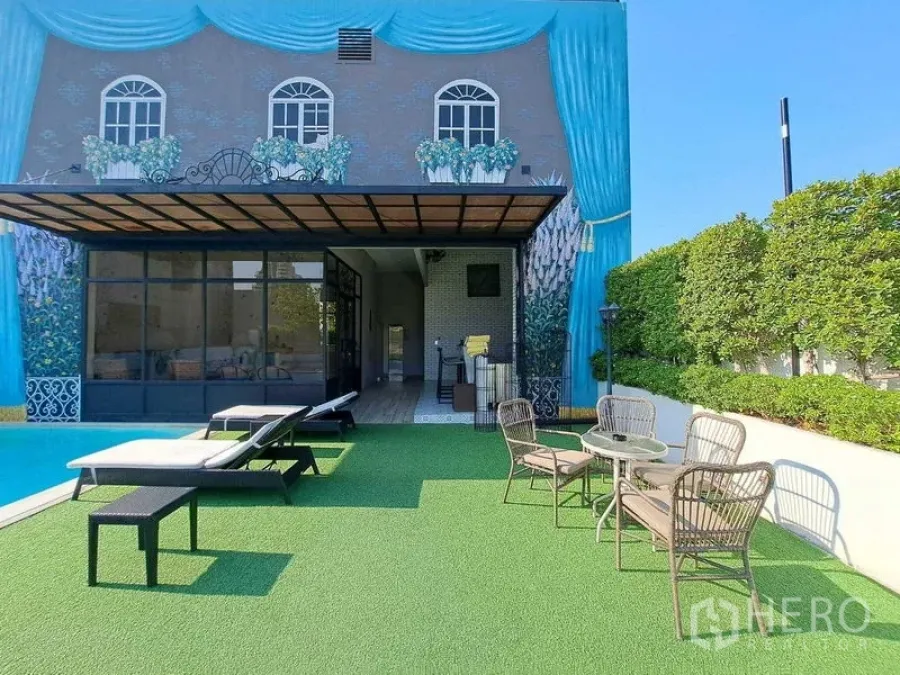 Retail Space for rent in Watthana, Bangkok - Pool deck with sun loungers, mural facade and glass doors opening to the terrace.
