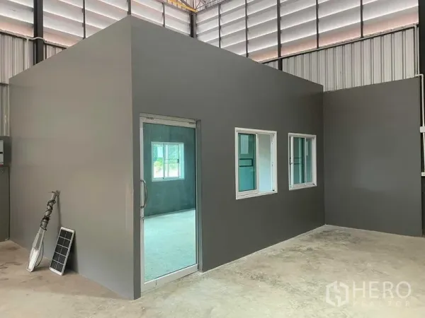 Warehouse for rent in Bang Bon, Bangkok - Internal office unit inside the warehouse with a glass door and sliding windows.