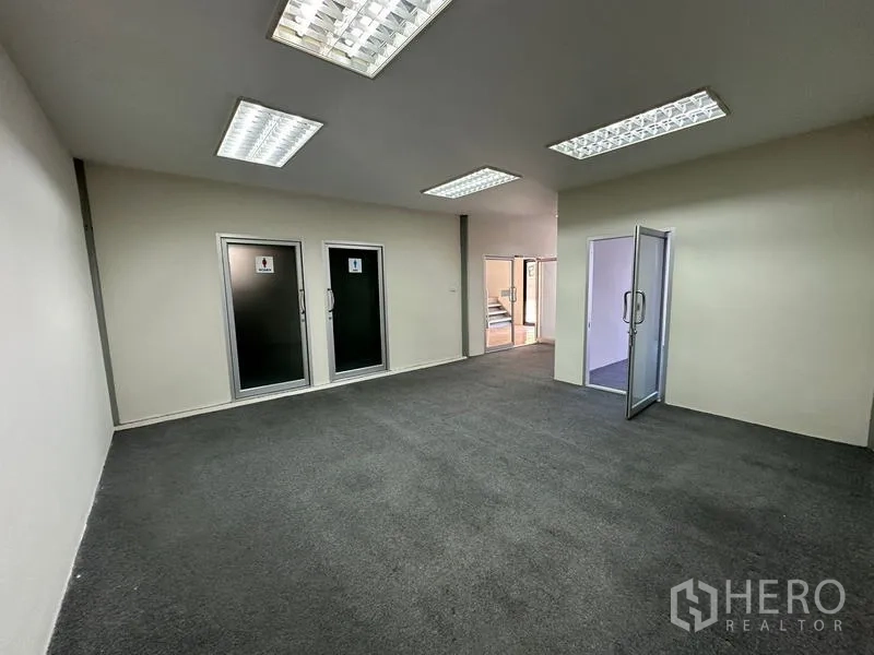 Office Space for rent - Office area with separate male and female restrooms and a glass meeting room.