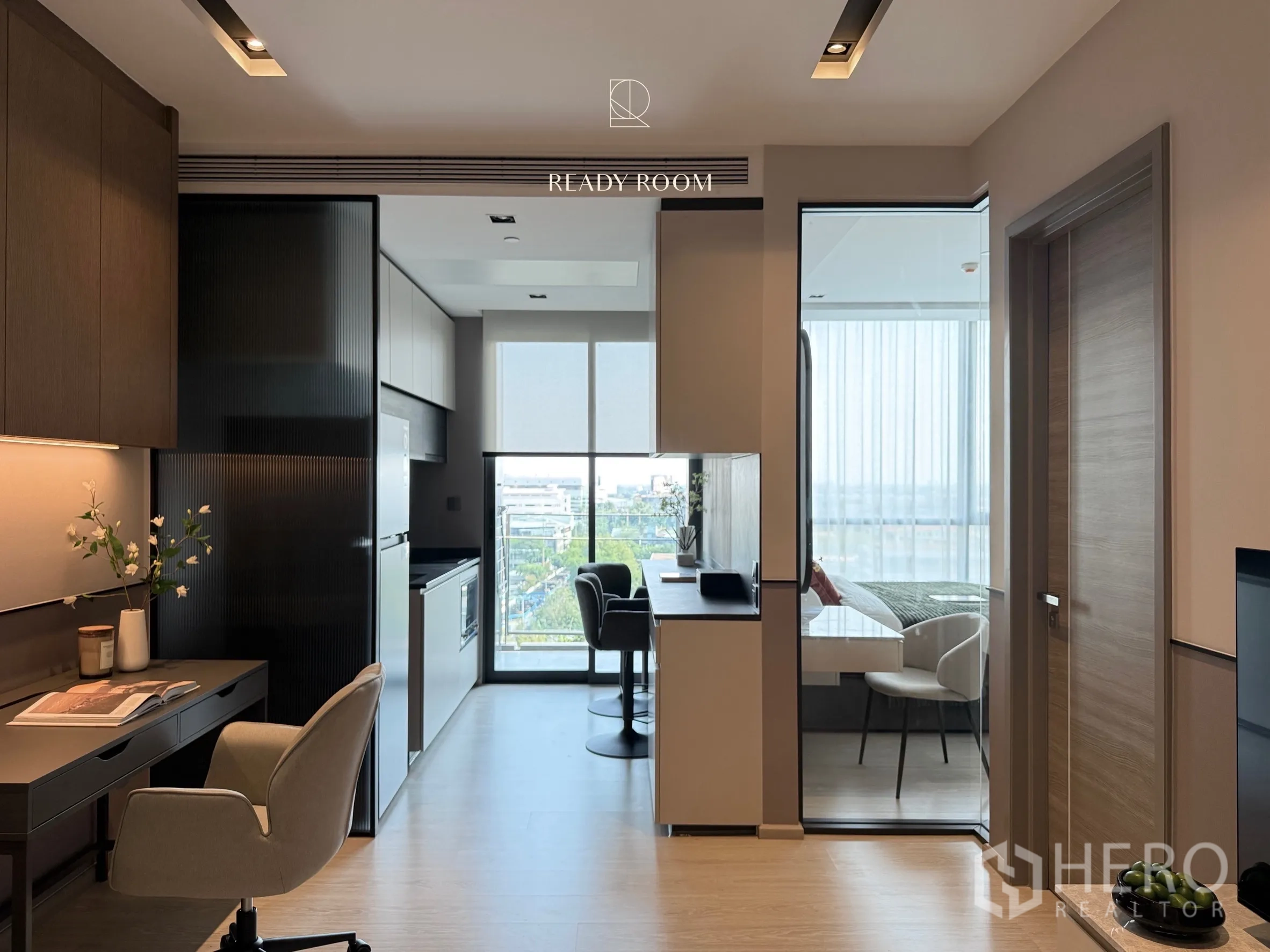 Condominium for rent in Khlong Toei, Bangkok - Kitchen corridor to the balcony with study counter and bedroom glass wall.