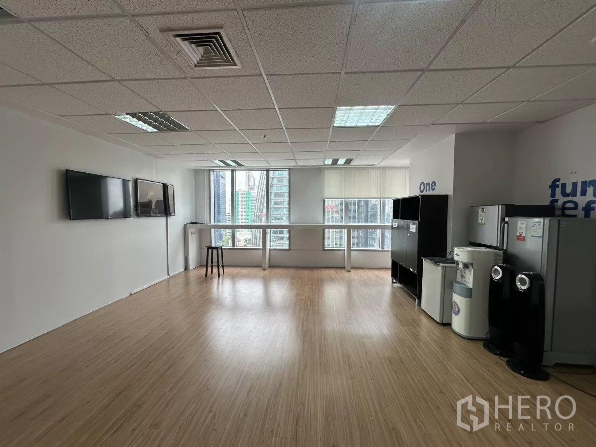 Office Space for rent in Watthana, Bangkok - Pantry and break area with wood flooring, fridges and city-view windows.