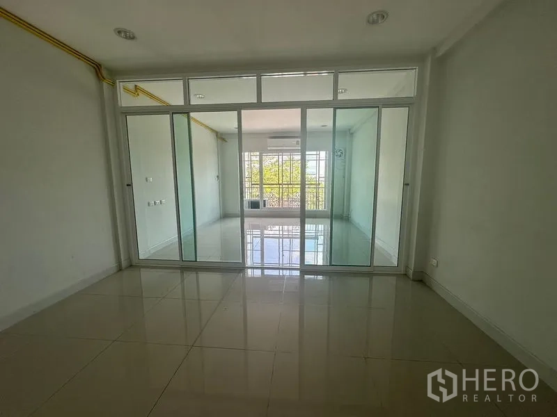 Home Office for rent in Bang Na, Bangkok - Glass-partitioned room leading to a balcony-facing area.