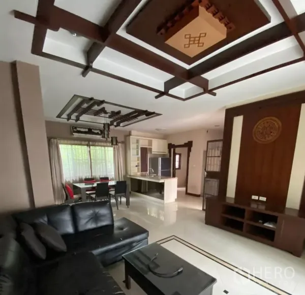Detached House for rent or sale in Mueang Nonthaburi, Nonthaburi - Open-plan living and dining area with feature ceiling connected to a pantry kitchen.