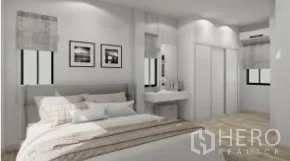 Detached House for rent or sale in Samut Prakan - Spacious master bedroom with bed, wall art, vanity and sliding closet doors.