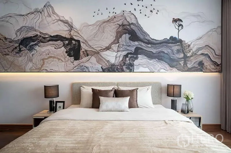 Condominium for rent in Pathum Wan, Bangkok - Detail of bedroom headboard and mountain-style mural with soft lighting.