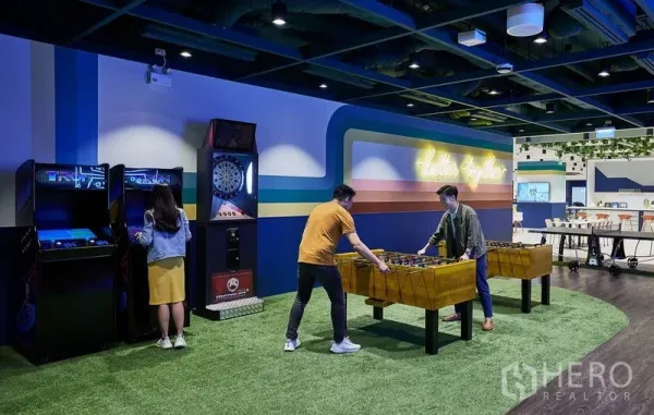 Office Space for rent in Pathum Wan, Bangkok - Recreation zone in an office with arcade machines, dart board and foosball tables.