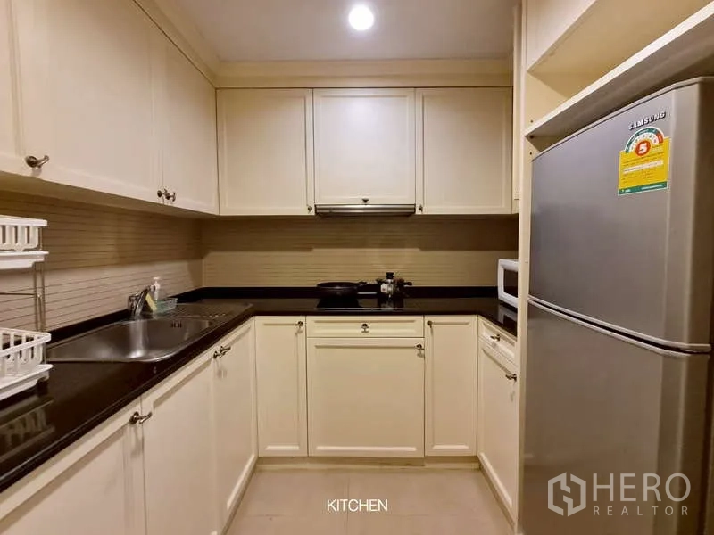 Retail Space for rent in Watthana, Bangkok - Second fitted kitchen with white cabinets and stainless refrigerator