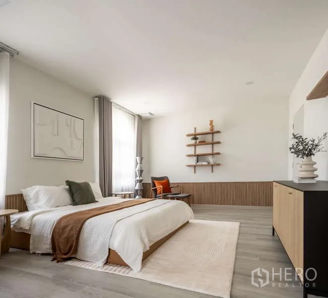 Detached House for rent or sale in Bang Phli, Samut Prakan - Master bedroom view showing bed, wall shelves and area rug.